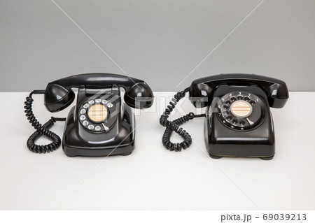 昭和レトロの黒電話2種の写真素材