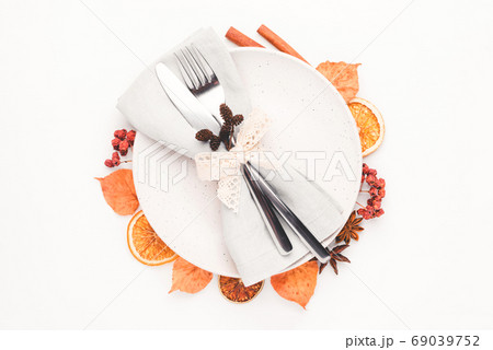 Thanksgiving autumn background decorated with autumn leaves, berries and spices. 69039752