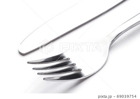 Steel fork and knife isolated on a white background. 69039754