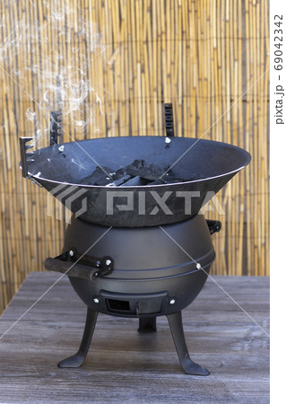 garden grill prepared for grilling 69042342