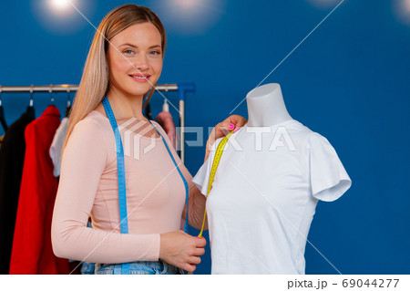 Close up photo of a seamstress at work Close up photo of a seamstress at work 69044277