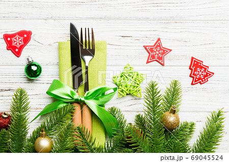 Top view of christmas decorations on wooden background. Fork and 69045524