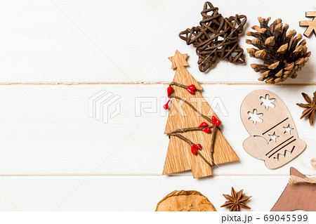 Top view of Christmas decorations and toys on wooden background. Top view of Christmas decorations and toys on wooden background. 69045599