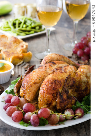 Thanksgiving dinner on rustic wooden background Thanksgiving dinner on rustic wooden background 69047643