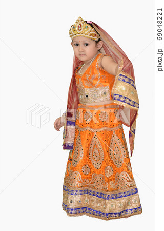 Little girl in Indian traditional dress. Little girl in Indian traditional dress. 69048221