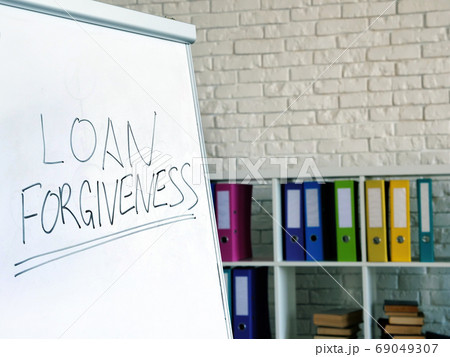 Loan forgiveness inscription on the white board in office. 69049307