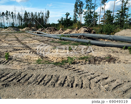 Deforestration, environmental destruction. The impact of industry on the environment, pipes laid in the forest. 69049319