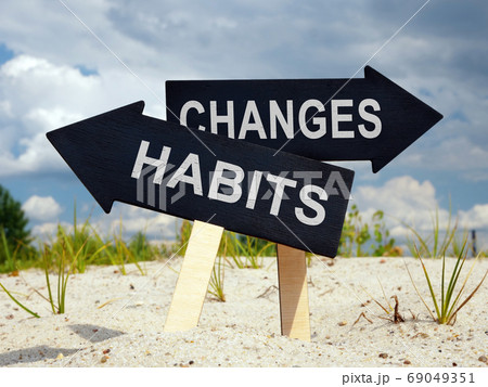 Old habits and changes ahead. Two black arrows. 69049351