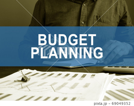 Budget planning concept. A man works with business papers. 69049352