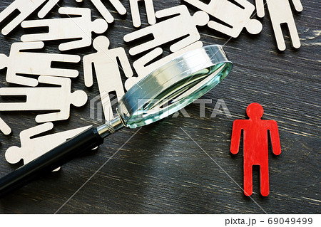 Human resource management and talent choice. Magnifying glass and figures. 69049499