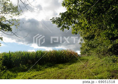 Storm clouds rolling over an idyllic rural landscape 69051518