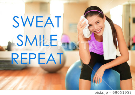 Fitness motivational quote for weight loss motivation. Words SWEAT SMILE REPEAT on gym background with fit Asian woman sweating doing exercise. Inspirational message text Fitness motivational quote for weight loss motivation. Words SWEAT SMILE REPEAT on gym background with fit Asian woman sweating doing exercise. Inspirational message text 69051955