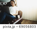 A women looking at notebook at home. working concept. 69056803