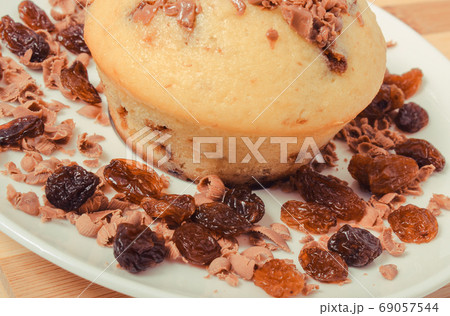 Fresh baked muffins with raisins. Delicious dessert 69057544