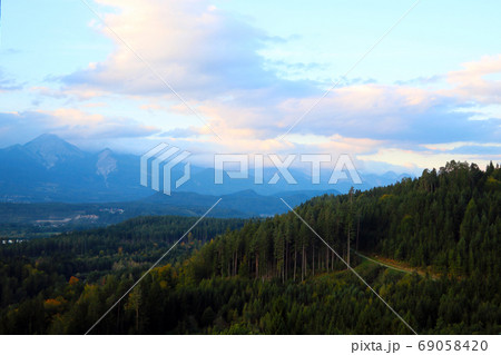 View of a beautiful bright sunset high in the mountains. selective focus. View of a beautiful bright sunset high in the mountains. selective focus. 69058420