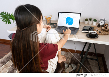 Attractive young beautiful asian woman working 69058898