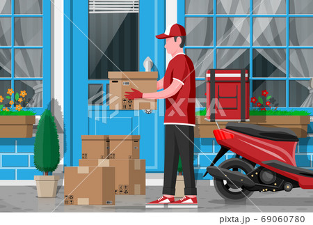 Man left cardboard boxes near house facade. Man left cardboard boxes near house facade. 69060780