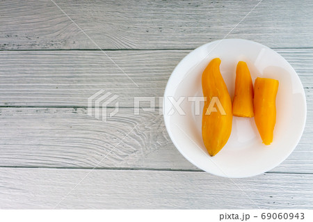 Ubi rebus or steam cassava is traditional malay dish on wooden background 69060943