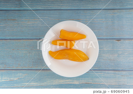 Ubi rebus or steam cassava is traditional malay dish on wooden background 69060945