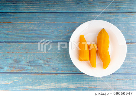 Ubi rebus or steam cassava is traditional malay dish on wooden background 69060947