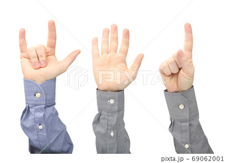 Raised hands of different men on white background Raised hands of different men on white background 69062001