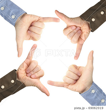 Four male hands with gestures opposite each other on a white bac Four male hands with gestures opposite each other on a white bac 69062019