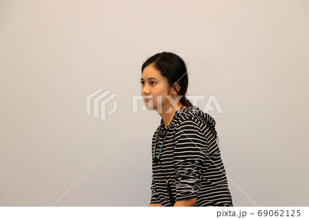 Asian modern woman in white and black stripes color of long-sleeved T-shirt Asian modern woman in white and black stripes color of long-sleeved T-shirt 69062125