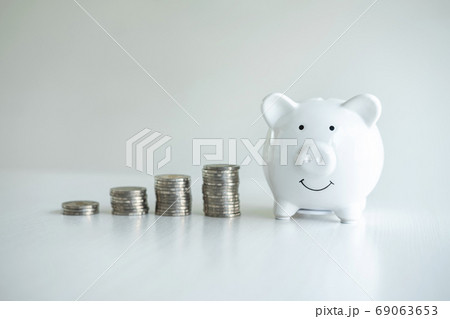 Image of piggy bank and stacking pile coins to Image of piggy bank and stacking pile coins to 69063653