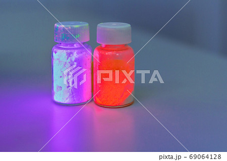 Photoluminescence chemical materials, called fluorescent. Powder glows in the dark under UV light radiation of different colors. Photoluminescence chemical materials, called fluorescent. Powder glows in the dark under UV light radiation of different colors. 69064128