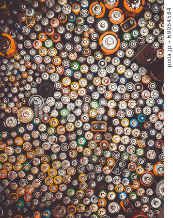 Old used batteries group. Top view background texture Old used batteries group. Top view background texture 69064584