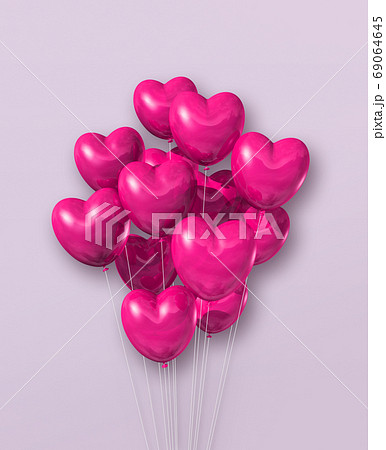 Pink heart shape air balloons group on a light purple background Pink heart shape air balloons group on a light purple background 69064645