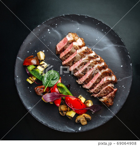 Beef tagliata meat with grilled vegetables 69064908