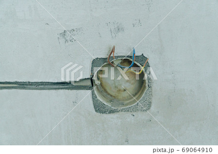 Holes in the concrete wall in the room for sockets 69064910