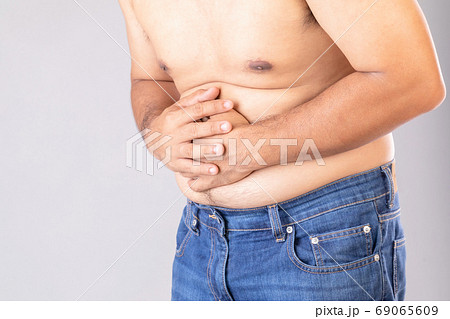 Stomach ache or pain on belly concept Stomach ache or pain on belly concept 69065609