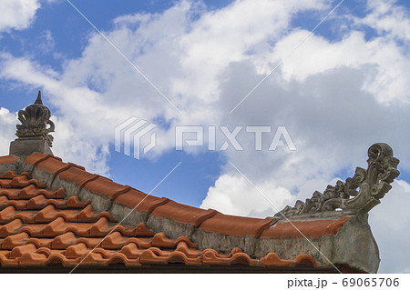Flashing orange tiled roof on blue sky. Flashing orange tiled roof on blue sky. 69065706