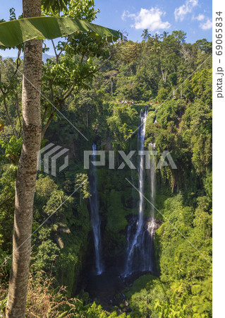 Sekumpul Waterfalls surrounded by tropical forest in Bali, Indonesia. 69065834