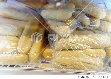 frozen bread in the supermarket refrigerator. ciabatta, loaf, hamburger buns frozen bread in the supermarket refrigerator. ciabatta, loaf, hamburger buns 69067103