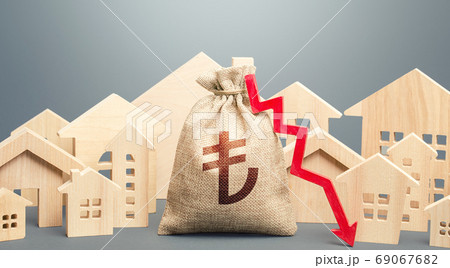 City residential buildings and turkish lira money bag with a red down arrow. Low demand for home buying. Lower mortgage interest rates. Falling prices for rental apartments. Low cost real estate. City residential buildings and turkish lira money bag with a red down arrow. Low demand for home buying. Lower mortgage interest rates. Falling prices for rental apartments. Low cost real estate. 69067682