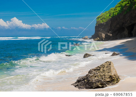 Tropical beach in Bali. Paradise beach and blue ocean, no people 69067855