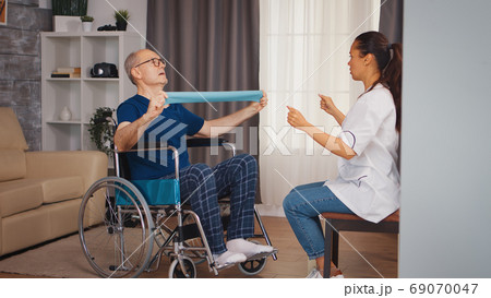 Disabled senior patient working out 69070047