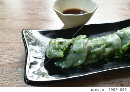 steamed Chinese rice flour dumpling stuffed fried chop garlic chives on plate dipping soy sauce steamed Chinese rice flour dumpling stuffed fried chop garlic chives on plate dipping soy sauce 69074046