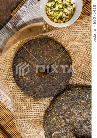 pressed puer tea top view. Chinese puer shu and shen in the form of pancakes. top view, vertical photo 69075419