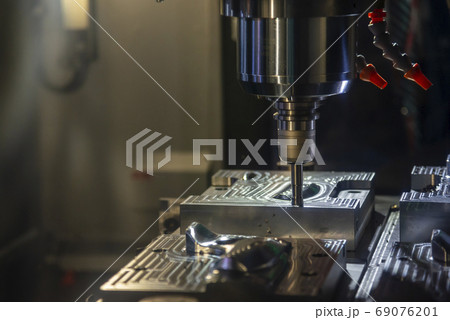 The CNC milling machine rough cutting . 69076201