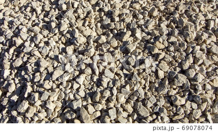 Modern gravel texture. Small stones, little rocks, pebbles in many shades of grey Modern gravel texture. Small stones, little rocks, pebbles in many shades of grey 69078074