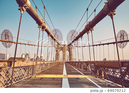 Retro toned picture of Brooklyn Bridge, New York City, USA. 69079212