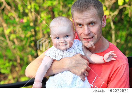 Dad and daughter in the park. Portrait of dad and child. Dad and daughter in the park. Portrait of dad and child. 69079674