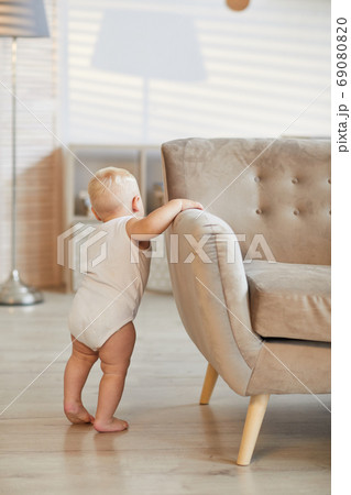 Toddler Standing At Sofa 69080820