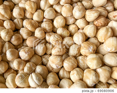 Close-Up Of Peeled Hazelnuts. Healthy Fresh Food Background. Close-Up Of Peeled Hazelnuts. Healthy Fresh Food Background. 69080906
