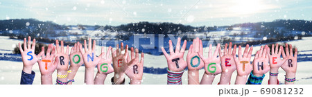 Children Hands Building Word Stronger Together, Snowy Winter Background 69081232