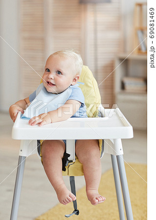Baby Boy In Highchair Baby Boy In Highchair 69081469